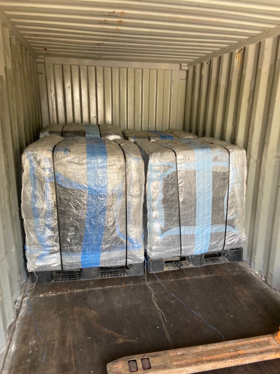 An overview of the pallets loaded into a container.